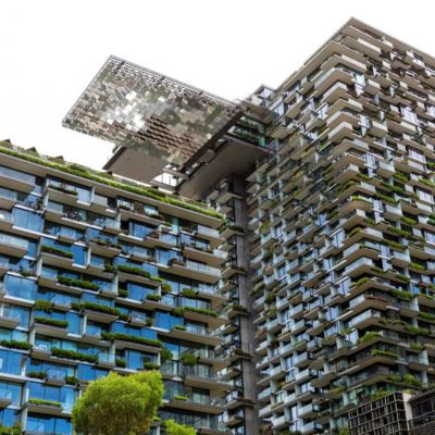 A skyscraper integrates plant life.