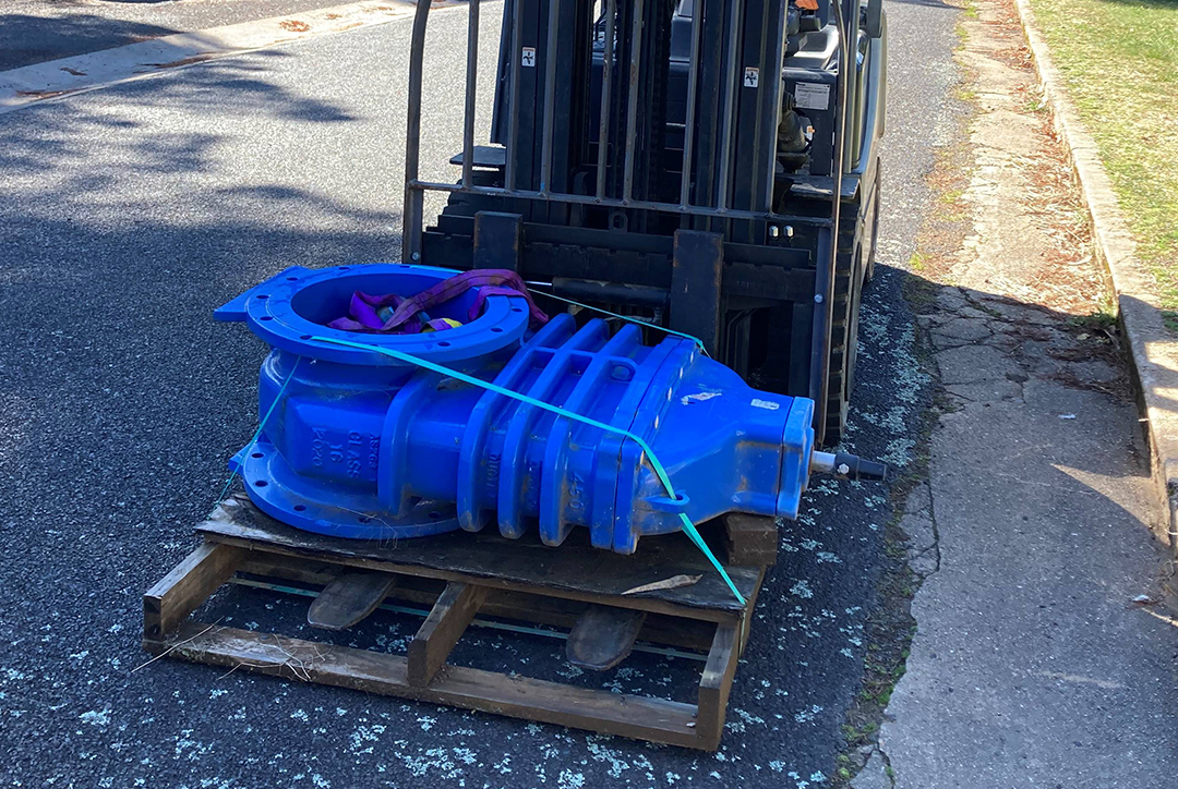 A replacement valve is moved by forklift.