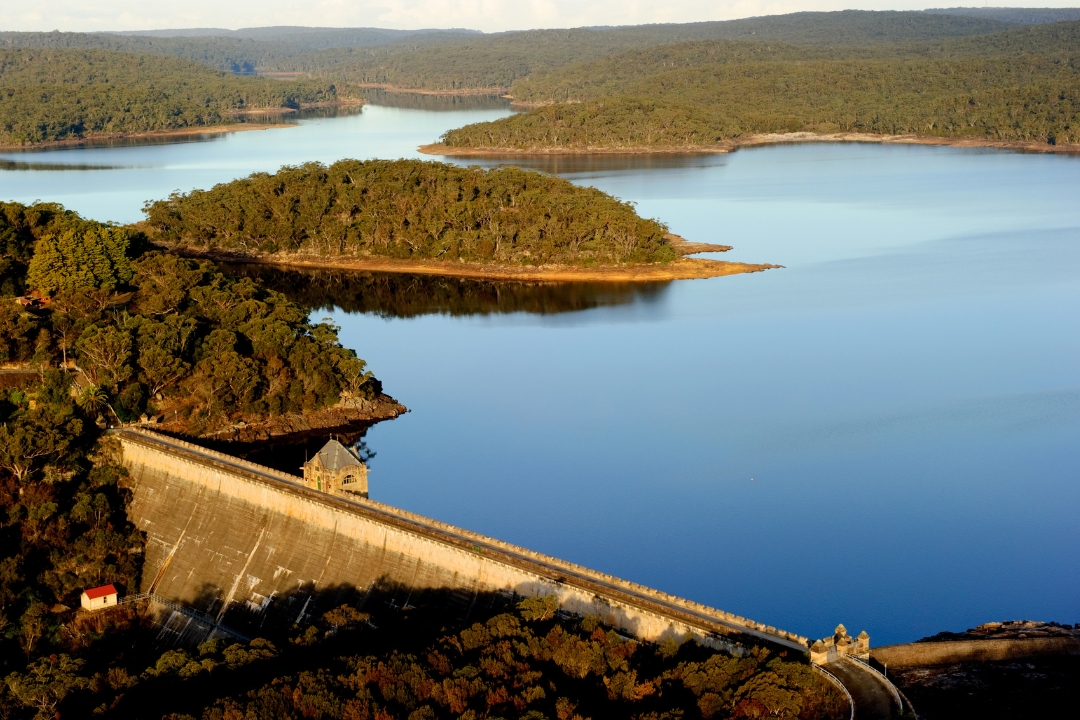 Aerial of dam wall at sunset